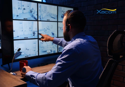 office worker looking at a few monitors